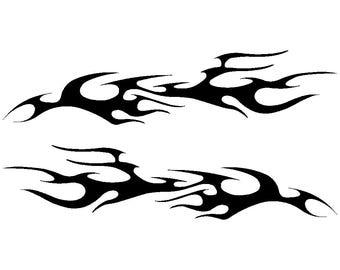 May include: Black flame decals. Two stylized flame designs are displayed against a white background. The flames have a dynamic, flowing shape, with sharp points and curves. The design is suitable for vehicles or other applications.