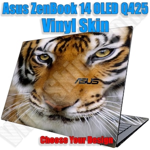 May include: A close-up of a tiger's face on a black laptop with the text "Asus ZenBook 14 OLED Q425 Vinyl Skin" and "Choose Your Design" at the top and bottom of the image.
