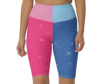 Könnte beinhalten: Eine hoch taillierte Radhose mit einem pinkfarbenen und blauen Farbblock-Design. Die Hose hat ein glitzerndes Muster und ist aus einem dehnbaren, bequemen Stoff gefertigt.