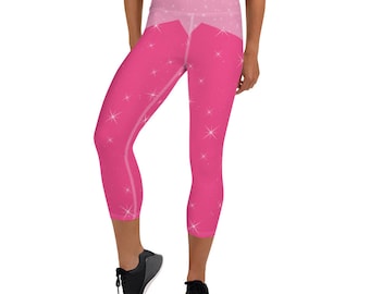 Könnte beinhalten: Rosa Yoga-Leggings mit hohem Bund und glitzerndem Muster. Die Leggings sind cropped und haben eine rosa-weiße Farbgebung.