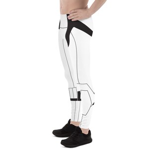May include: White leggings with a black geometric design. The leggings have a black waistband and a black stripe down the side.