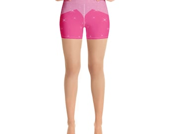 Könnte beinhalten: Rosa Yoga-Shorts mit glitzerndem Design. Die Shorts haben einen hohen Bund und eine figurbetonte Silhouette.