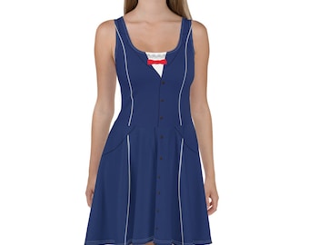 May include: A blue sleeveless dress with a white button-up shirt design. The dress has a white trim and a red bow tie.