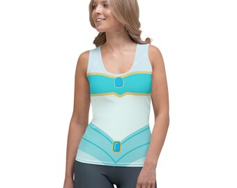 May include: A white tank top with a blue and gold design. The design features a blue gem in the center of a gold band.