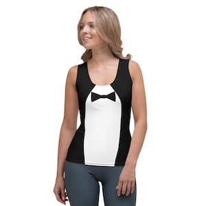 May include: Black and white tank top with a tuxedo design. The sleeveless top features a white front with a black bow tie and black sides, creating the illusion of a tuxedo.
