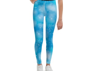 May include: Blue leggings with a snowflake pattern. The leggings are made of a soft, stretchy material and are perfect for everyday wear.