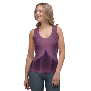 May include: A purple tank top with a graphic design of stylized leaves and branches. The design is in shades of purple and white.