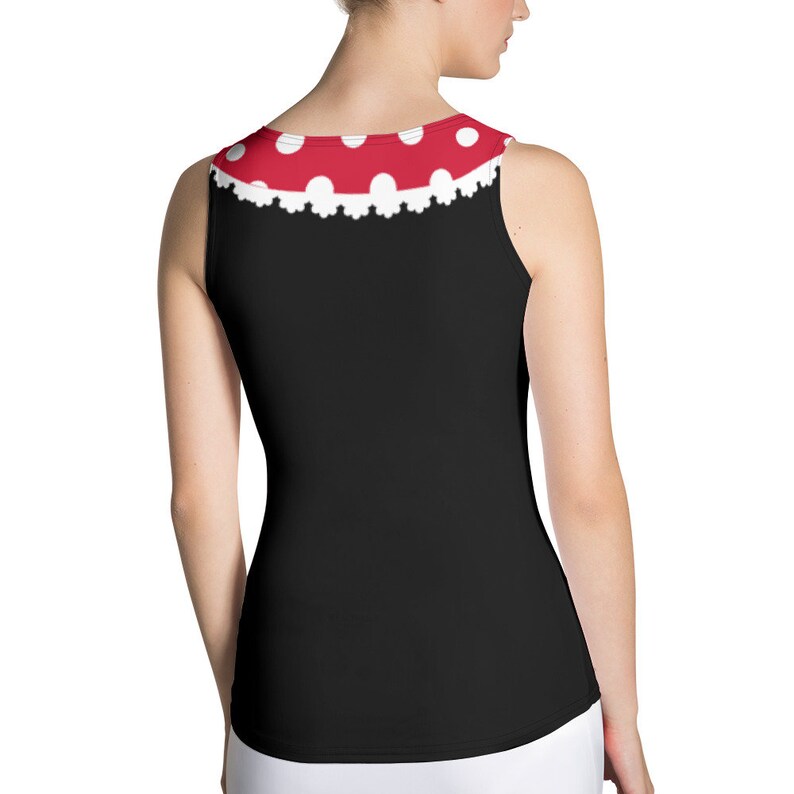 May include: Black tank top with a red and white polka dot trim around the neckline. The trim has a white lace design.