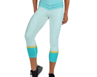 May include: Light blue high-waisted cropped leggings with a white star pattern and a turquoise and gold stripe at the bottom.