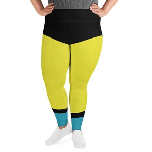 May include: Yellow and black leggings with a blue stripe at the bottom. The leggings have a high waist and are made of a stretchy material.