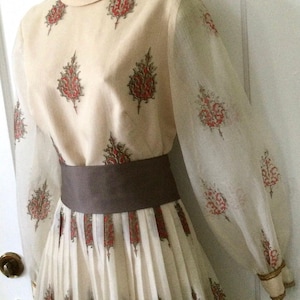 Alfred Shaheen Pleated 1970’s Vintage Maxi Dress - Khaki 1970s Vintage Crest Print Long Sleeve Pleated Hawaiian Maxi Dress by ALFRED SHAHEEN