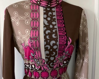 May include: A long-sleeved dress with a high neck and a geometric pattern in shades of brown, pink, and white.