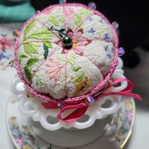Machine Embroidered pin cushion with hand crocheted bottom