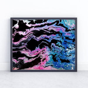 May include: Abstract painting with swirling blue, pink, and white paint on a black background. The painting is framed in a black frame.