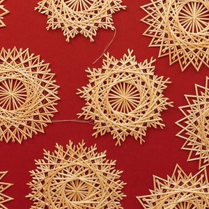 Set of straw snowflakes of different sizes. Christmas tree decoration. Straw stars. Straw snowflakes. Christmas gifts. Original design