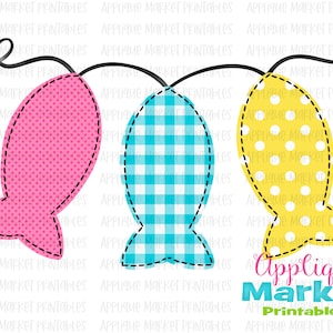 May include: A garland of three fish-shaped fabric ornaments. The fish are pink with white polka dots, blue with white gingham, and yellow with white polka dots. The garland is strung with black thread and has a loop at each end.