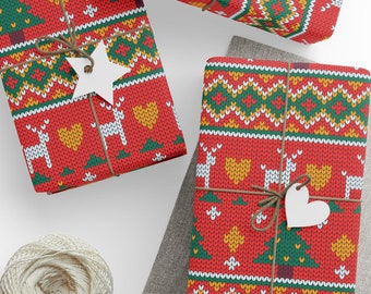 May include: Three red and green Christmas gift boxes with a knitted pattern. The boxes are wrapped with twine and decorated with white paper stars and hearts.
