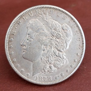 Antieke Amerikaanse zilveren dollar uit 1878. 1878 S Morgan zilveren dollar. Antieke zilveren munt uit de VS E Pluribus Unum.