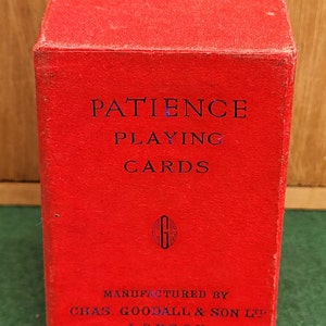 May include: Red box of Patience Playing Cards manufactured by Chas. Goodall & Son Ltd. London.