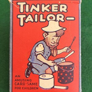 May include: A red box with the words "Tinker Tailor - An Amusing Card Game For Children" printed on it. The box features a cartoon illustration of a person wearing a hat and overalls, holding a spoon and a pot.