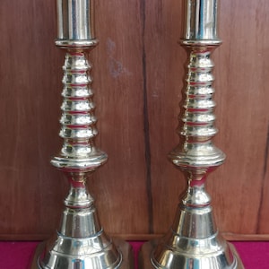 A Nice Pair Of Antique Brass Candlesticks. Pair Of Antique Brass Candlesticks With &quot;Push Up&quot; Candle Stub Ejectors.