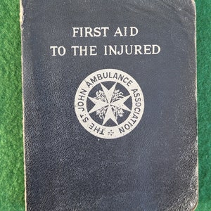 Vintage 1942 WWII Era First Aid Book. First Aid To The Injured With Fold-Out Skeleton Illustration - The St John Ambulance Association.