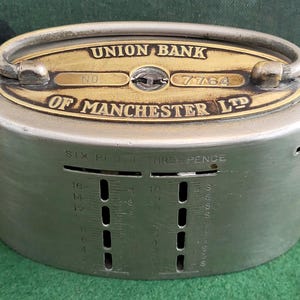 Antique Coin Bank - Union Bank Coin Bank. Antique 1920&#39;s Union Bank Of Manchester Ltd Metal Coin Bank.