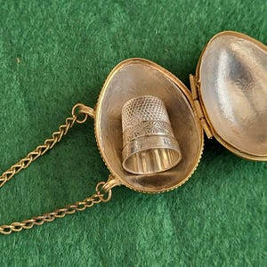 Vintage Brass Egg Thimble Holder. Ornate Brass Thimble Egg With Small Chain And Vintage Silver Thimble Inside.