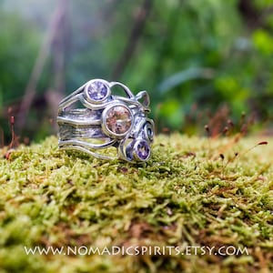 Amethyst and Citrine solitaires set in a thick textured 925 sterling silver band with spirals size 8