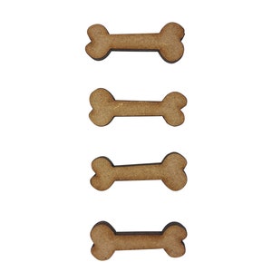 May include: Four brown wooden dog bone shapes arranged vertically.