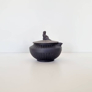 Wedgwood Black basalt creamer with lid and Widow of Zarephath engine turned decoration, 20th century