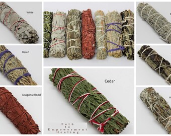 May include: A selection of sage smudge sticks, such as White, Desert, Dragons Blood, Cedar, Blue, Yerba, and Black (Mugwort). Each bundle is tied with coloured twine. The image includes the text "Path to Empowerment Healing."