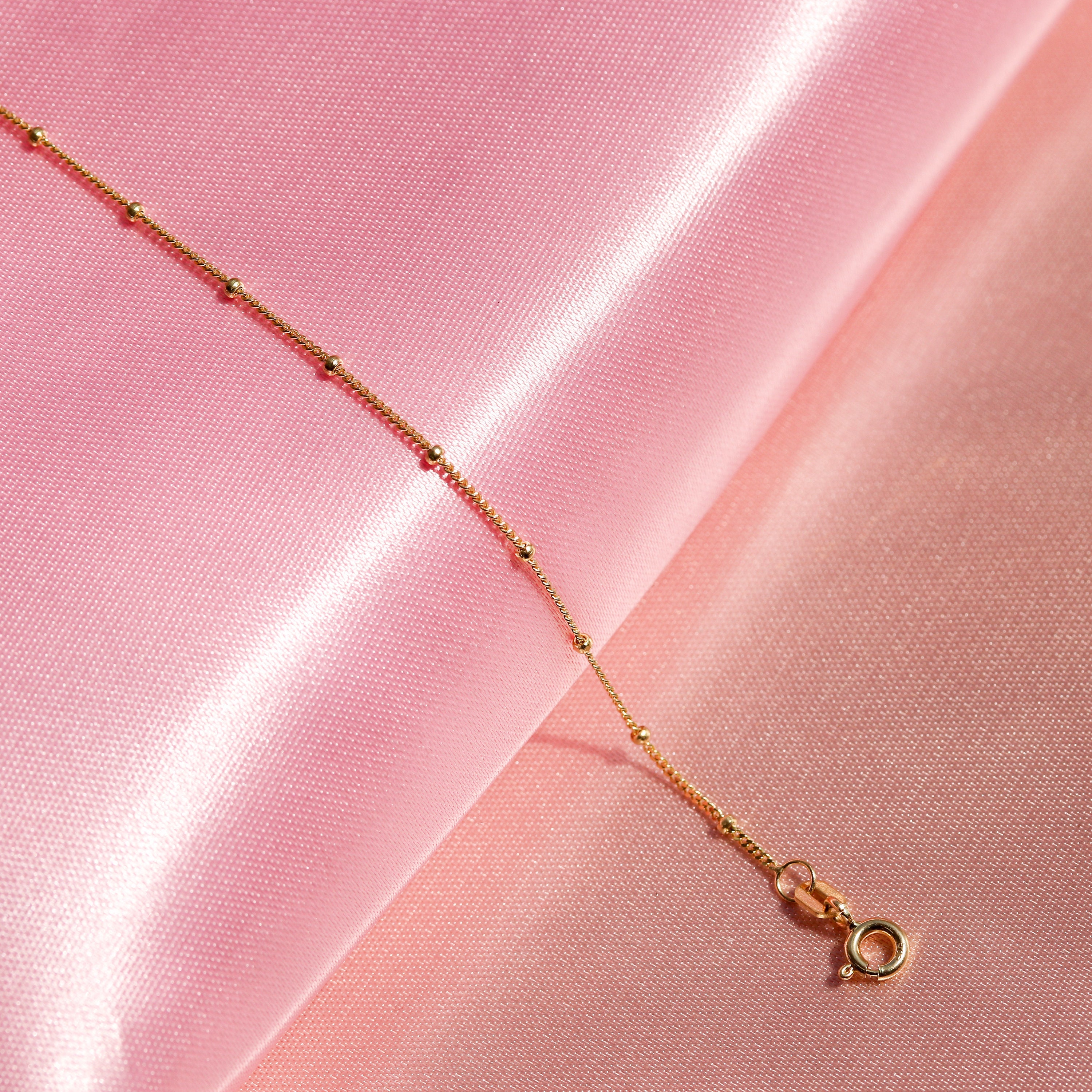 Solid gold satellite chain deals