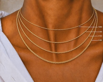 May include: Four gold-toned rope chains layered around a neck, with labels indicating thicknesses of 1MM, 2MM, 3MM, and 4MM. Each chain features a twisted, textured design that creates a continuous spiral pattern throughout the length of the metal.