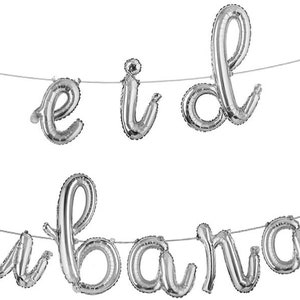 May include: Silver foil balloon banner spelling "Eid Mubarak".
