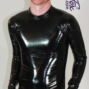 May include: A black, shiny, long-sleeved shirt and pants with a zipper. The shirt has a mock neck.