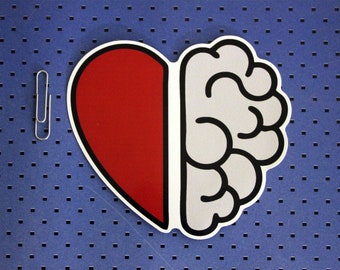 May include: A red heart and a grey brain are joined together, forming a single shape. The heart and brain are outlined in black.