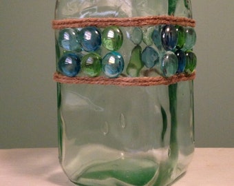 Green tinted glass carafe with glass "gems" and jute