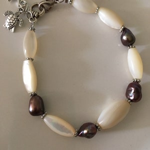 Mother of pearl and freshwater pearl bracelet with sea turtle and starfish charms