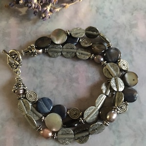 Three strand bracelet with shell and pearl beads