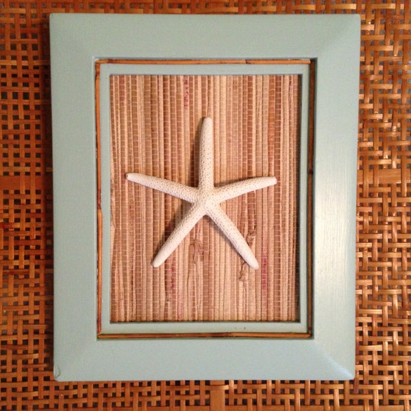 White starfish in rustic aqua wood frame featuring grasscloth backing and bamboo trim