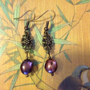 Bronze and freshwater peacock pearls
