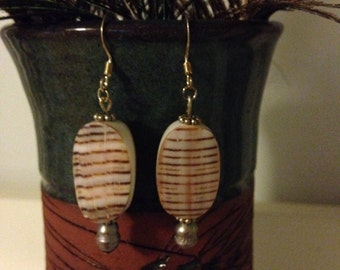 Brown striped oval shell earrings with freshwater pearls