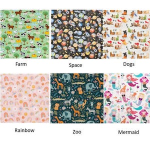 May include: A collection of fabric swatches with various patterns. Designs include a farm scene with animals, a space theme with planets, dogs, rainbows, zoo animals, and mermaids. Each swatch is labeled with its theme.