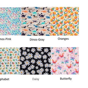 May include: A collection of fabric swatches featuring various patterns. Designs include floral, dinosaur, orange, daisy, butterfly, and alphabet prints. Each swatch is labeled with its corresponding pattern name, such as "Dinos-Pink" and "Oranges".
