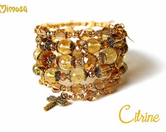 Meerstrengige armband met citrienkralen, met goud omwikkelde sieraden
