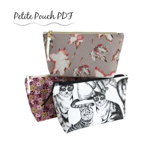 May include: Three fabric pouches with zip closures. The top pouch is taupe with a leaf pattern in red and white. The middle pouch has a floral pattern in pink and gold. The bottom pouch features a black and white cat print. Text on top reads "Petite Pouch PDF".