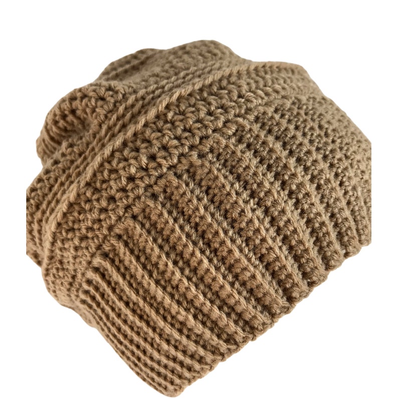 May include: A brown crocheted beanie hat with a ribbed texture.