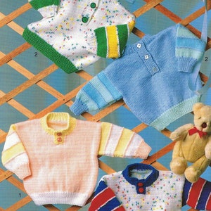 May include: Four knitted baby sweaters in different colors and patterns. The sweaters have a button closure at the neck. The sweaters are displayed on a wooden lattice background.