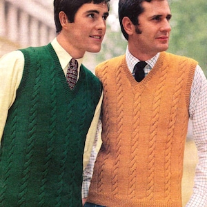 May include: Two men in cable-knit V-neck vests. One vest is dark green, the other is a golden-brown colour. Both vests have a textured, vertical cable pattern. The men are wearing collared shirts and ties under the vests.